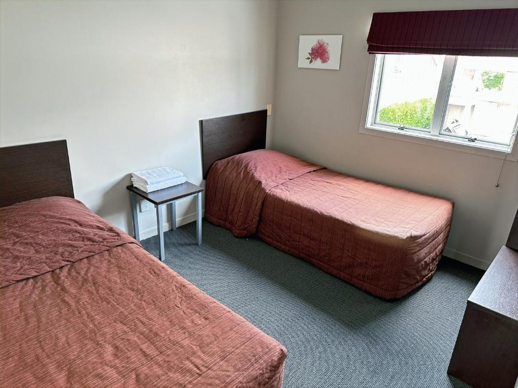 Postel nebo postele na pokoji v ubytování Arena Lodge
