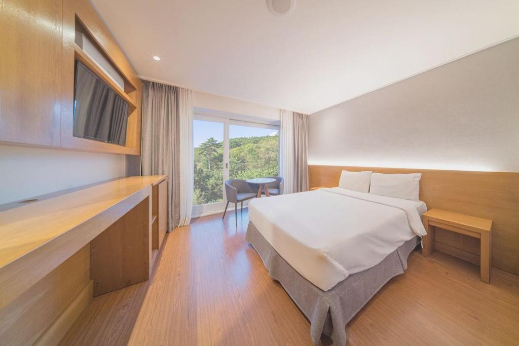 Postel nebo postele na pokoji v ubytování EL Hotel