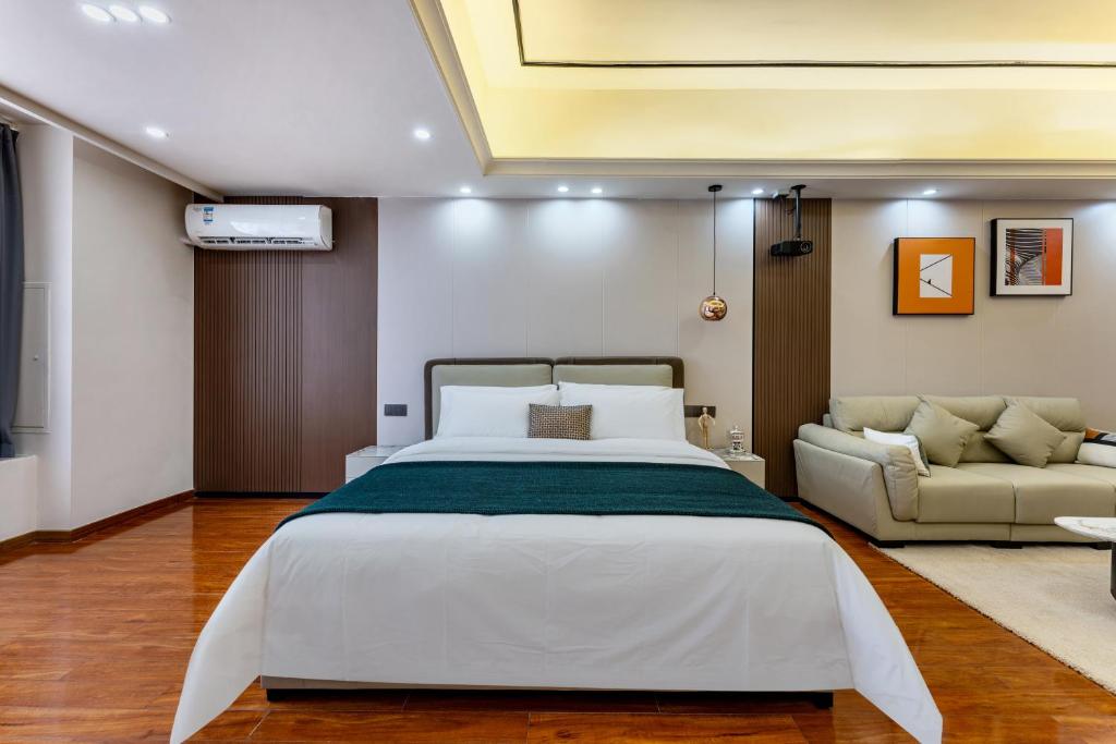 Postel nebo postele na pokoji v ubytování East Maple International Apartment - Guangzhou Luogang Wanda Plaza Suyuan Metro Station