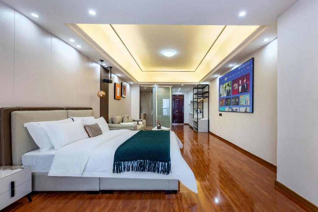 Postel nebo postele na pokoji v ubytování East Maple International Apartment - Guangzhou Luogang Wanda Plaza Suyuan Metro Station