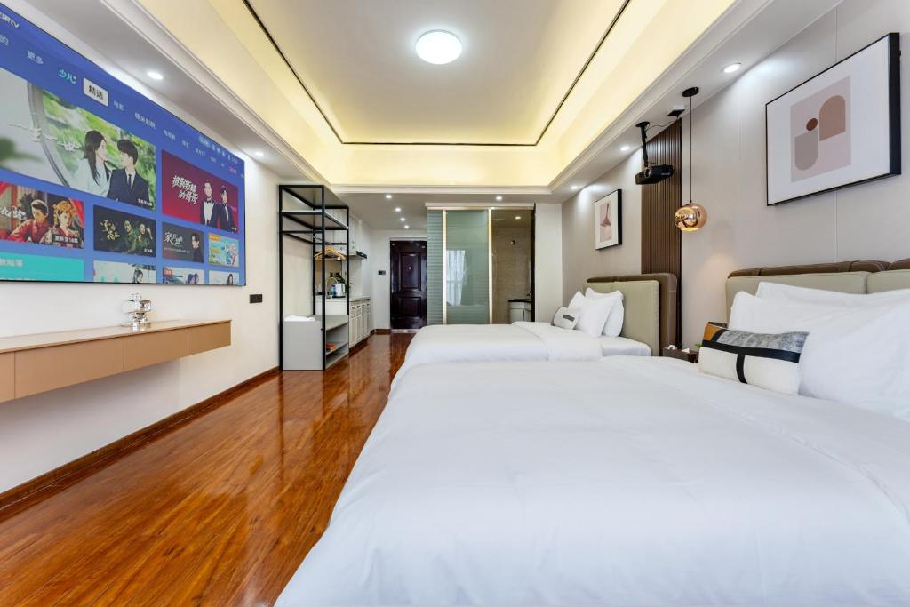 Postel nebo postele na pokoji v ubytování East Maple International Apartment - Guangzhou Luogang Wanda Plaza Suyuan Metro Station