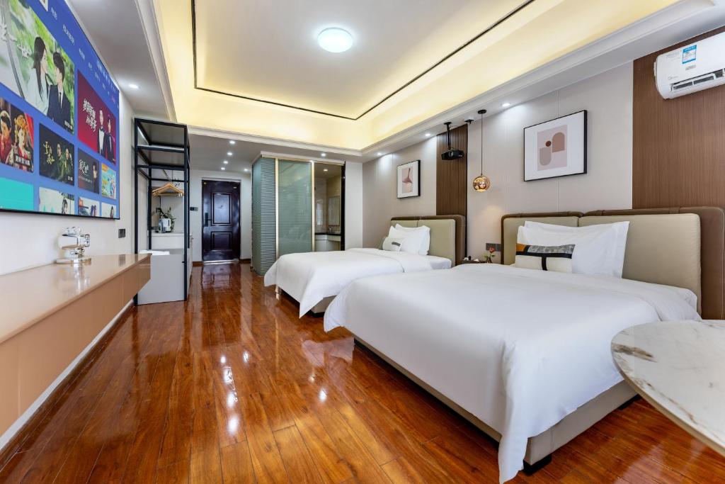 Postel nebo postele na pokoji v ubytování East Maple International Apartment - Guangzhou Luogang Wanda Plaza Suyuan Metro Station