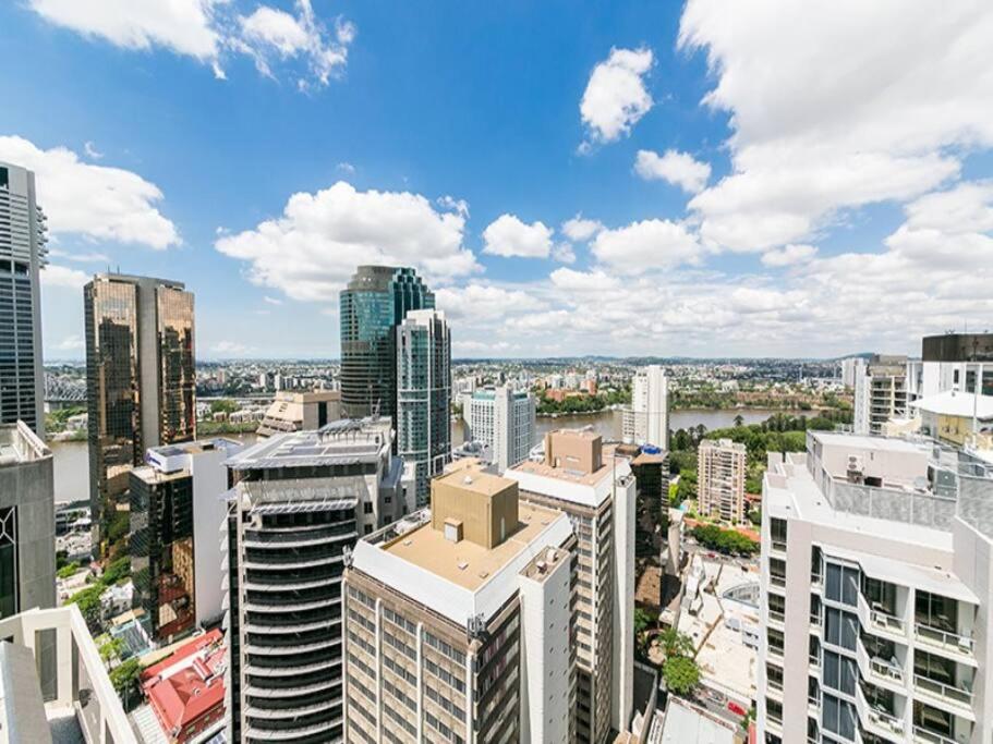 an aerial view of a city with tall buildings at 37F Brisbane CBD Apartment with City Views and Pool in Brisbane