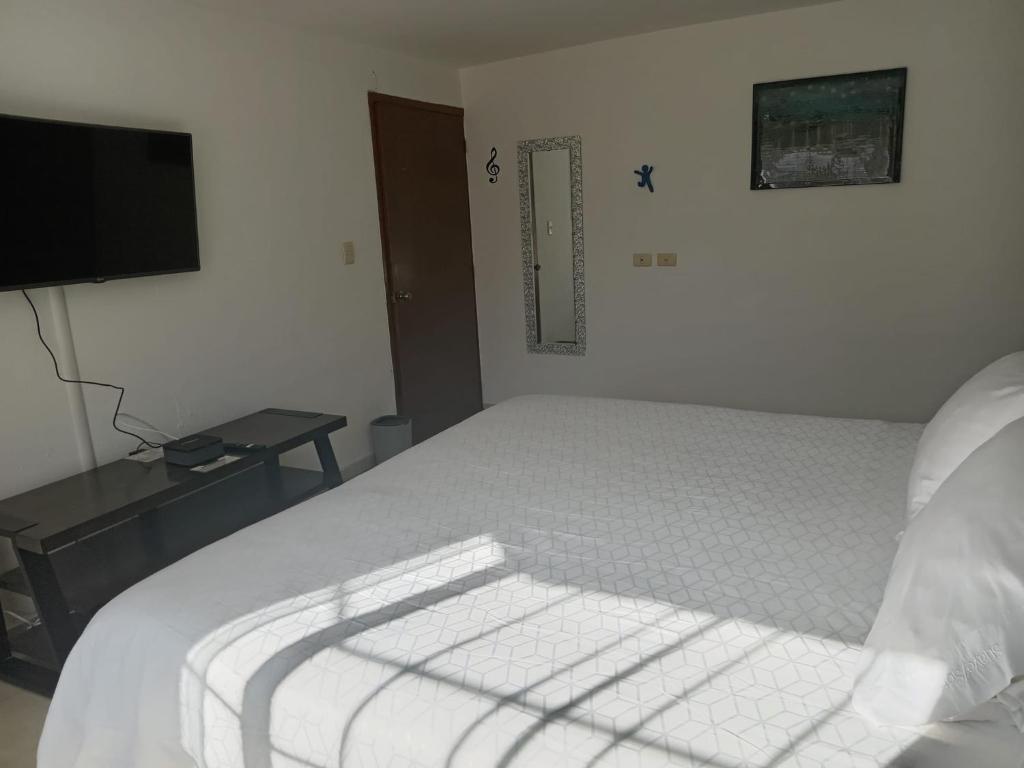 Postel nebo postele na pokoji v ubytování Casa de los Mandalas 1