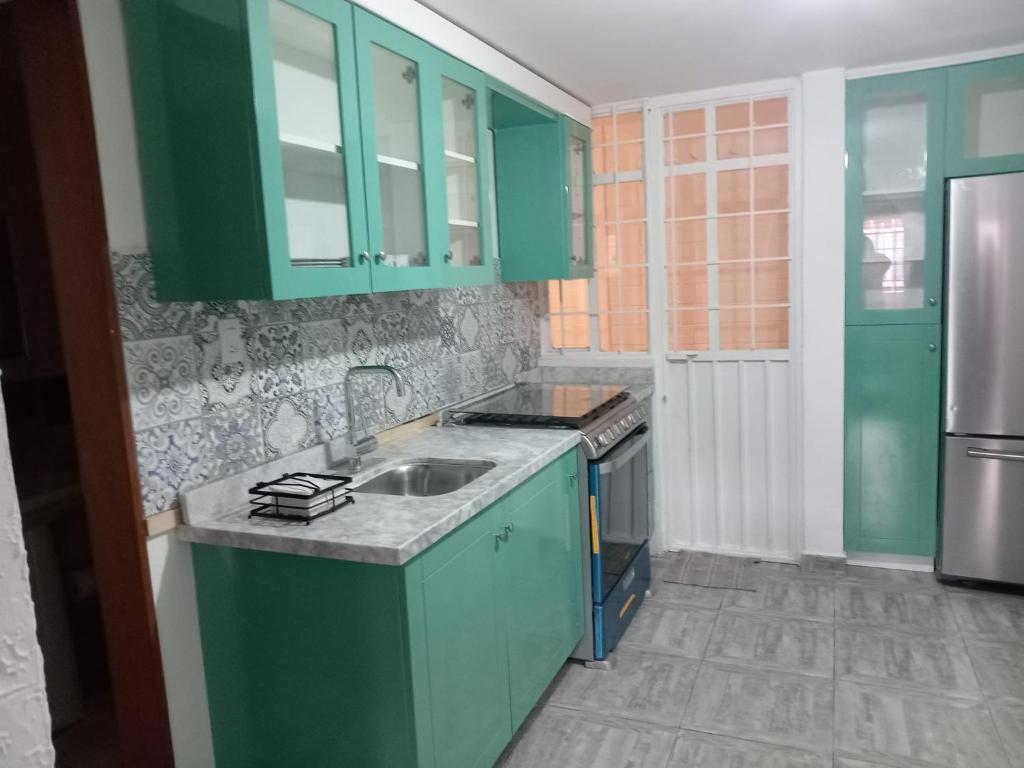 Kuchyň nebo kuchyňský kout v ubytování Casa de los Mandalas 1