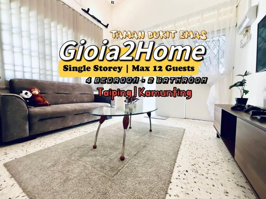 a living room with a couch and a table at Gioia2Home 5 mins to Taiping/Kamunting in Taiping