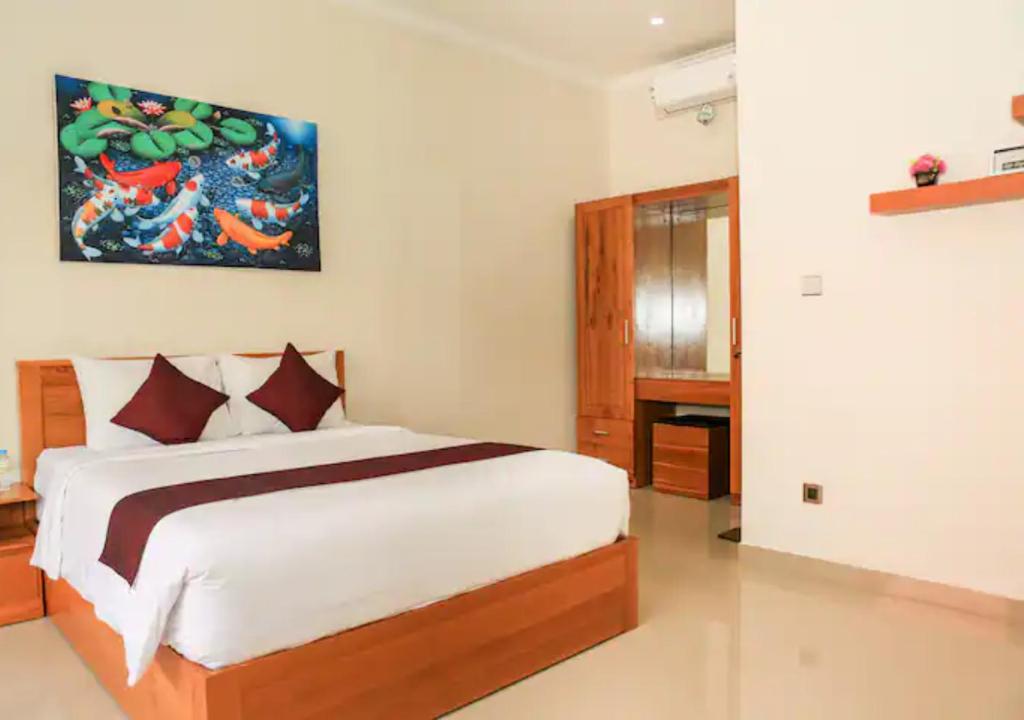 Postel nebo postele na pokoji v ubytování Wayan House Seminyak