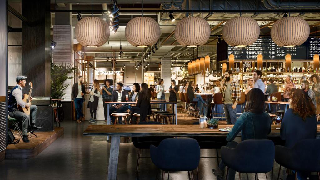 a restaurant with people sitting at tables and a bar at BRAND NEW home with EXCLUSIVE Bathroom in Toronto