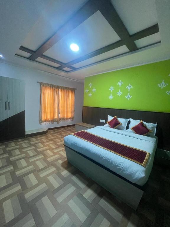 Postel nebo postele na pokoji v ubytování ooty vpr residency
