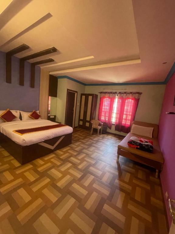 Postel nebo postele na pokoji v ubytování ooty vpr residency