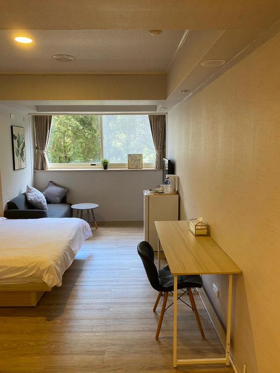 Postel nebo postele na pokoji v ubytování Meworld Hotel - Zhongshan