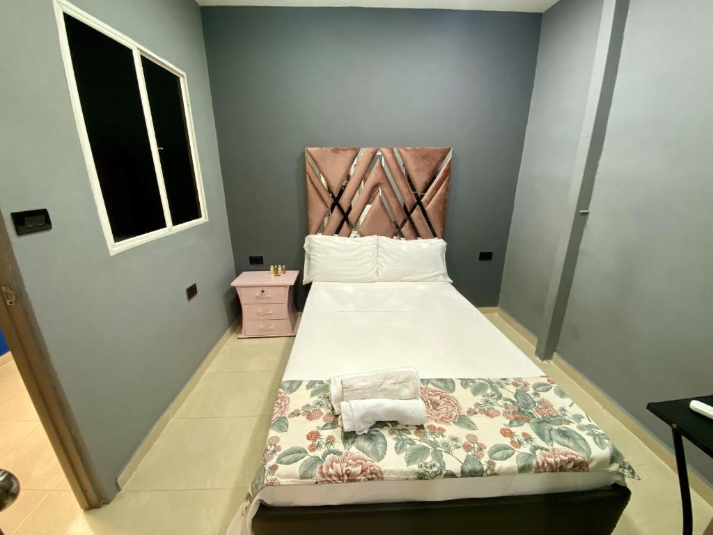 Una cama o camas en una habitación de Casa Mango