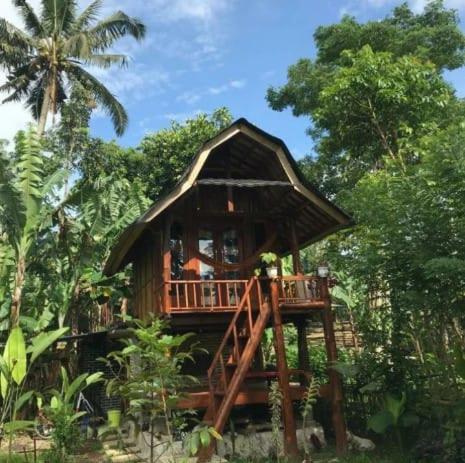 a small hut in the middle of a forest at Moksha glamping in Tetebatu