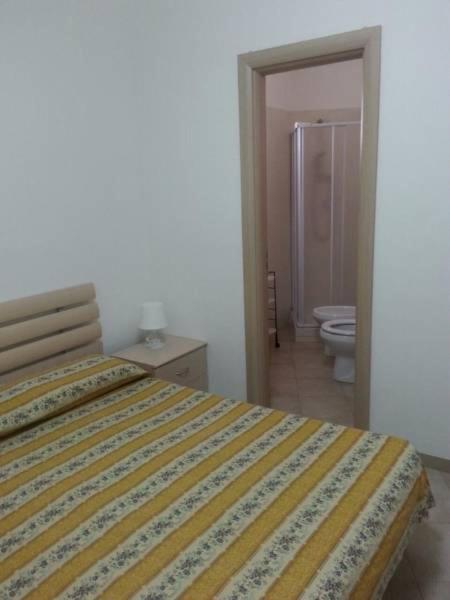 Postel nebo postele na pokoji v ubytování Camping Cala dei Ginepri