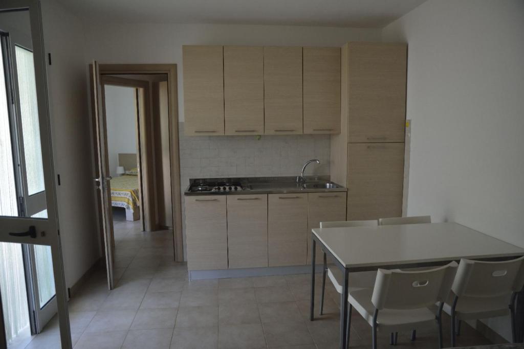 Kuchyň nebo kuchyňský kout v ubytování Camping Cala dei Ginepri