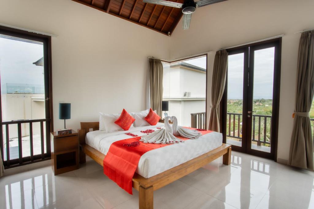 Postel nebo postele na pokoji v ubytování Jimbaran Sea View Villa