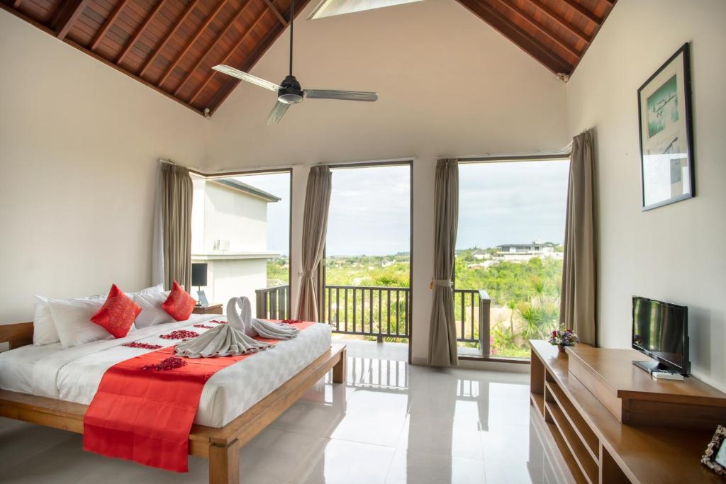 Postel nebo postele na pokoji v ubytování Jimbaran Sea View Villa