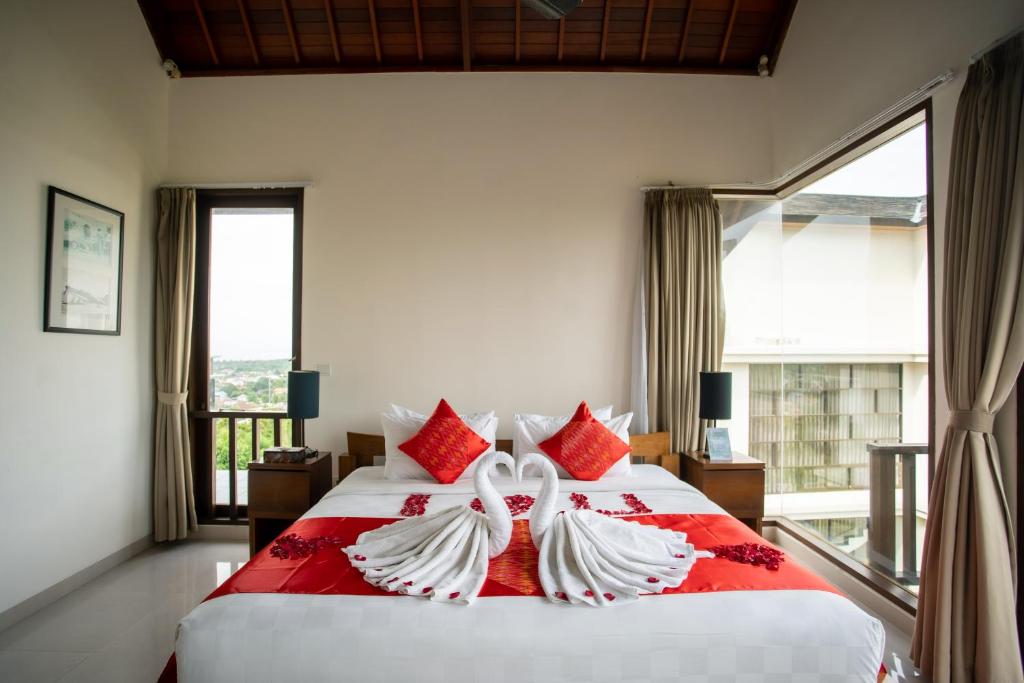 Postel nebo postele na pokoji v ubytování Jimbaran Sea View Villa