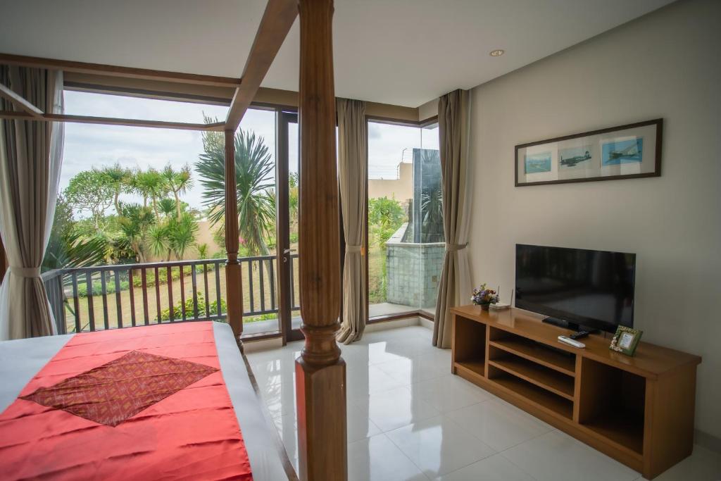 TV a/nebo společenská místnost v ubytování Jimbaran Sea View Villa