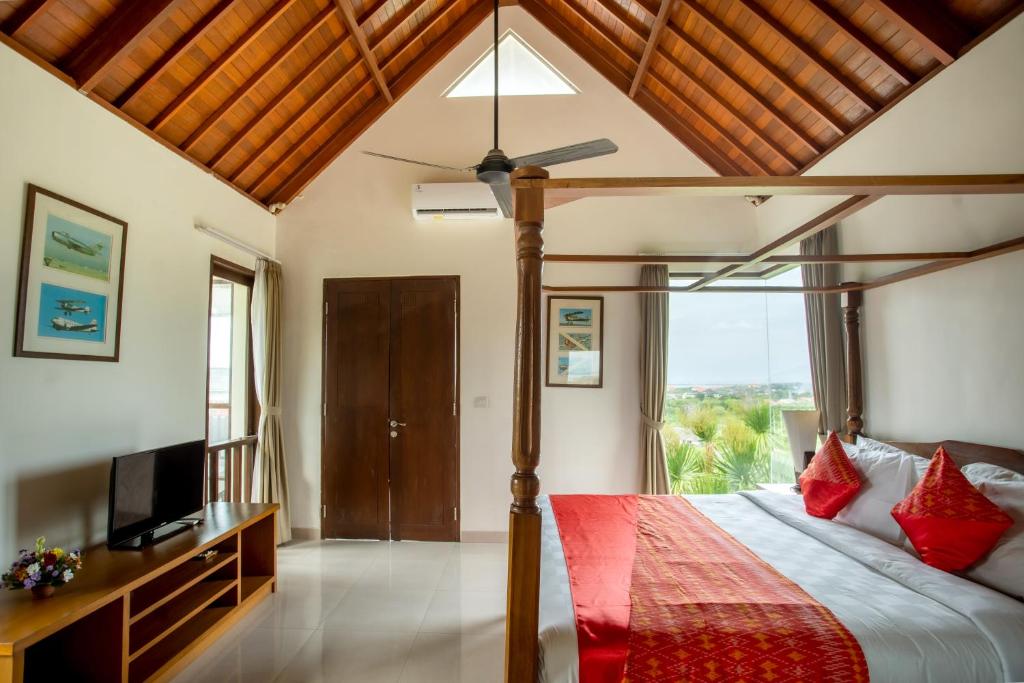 Postel nebo postele na pokoji v ubytování Jimbaran Sea View Villa