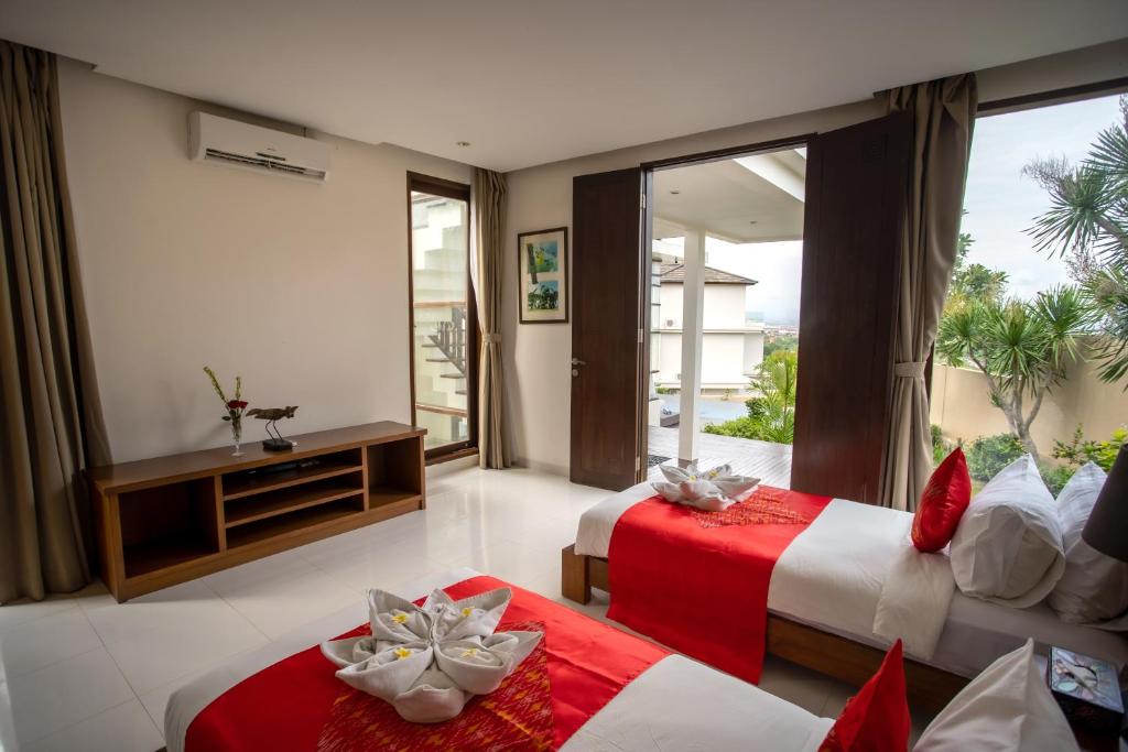 Postel nebo postele na pokoji v ubytování Jimbaran Sea View Villa
