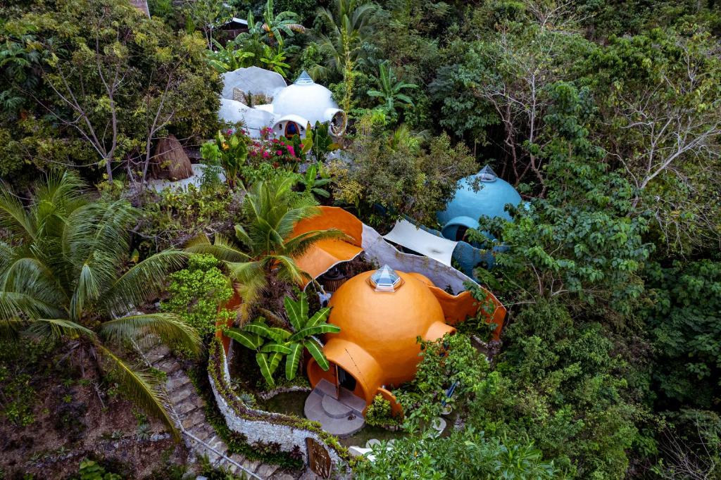 an aerial view of a water park in the forest at Jungle KingDomes Guest House in San Juan