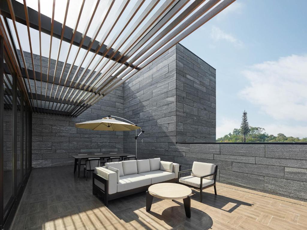 Posezení v ubytování Banyan Tree Dongguan Songshan Lake