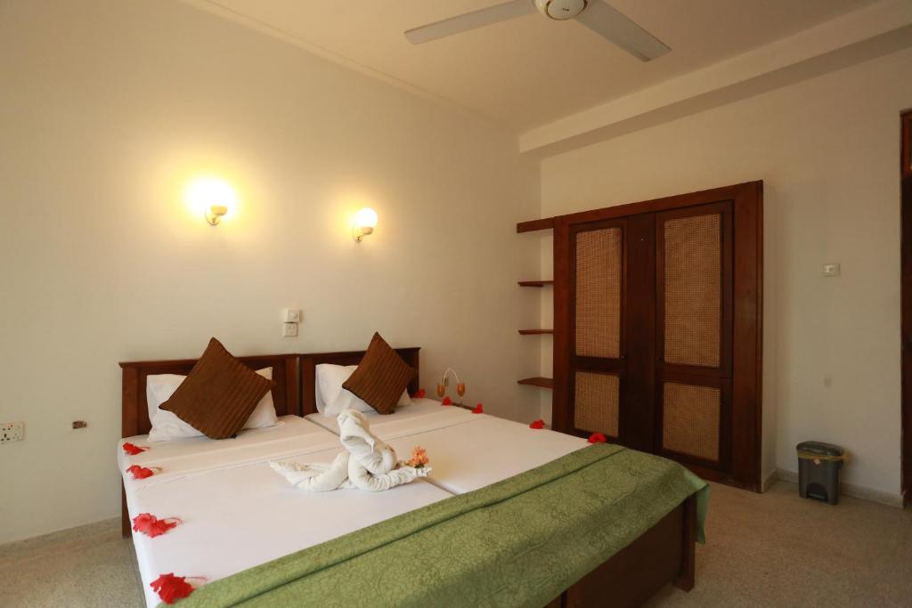 Postel nebo postele na pokoji v ubytování Sumadai Beach Hotel