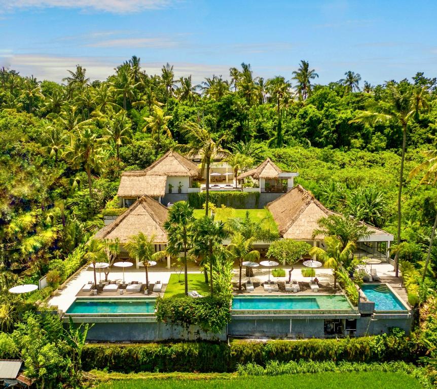 an aerial view of a resort with a swimming pool at Balidroomvilla's in Karangasem