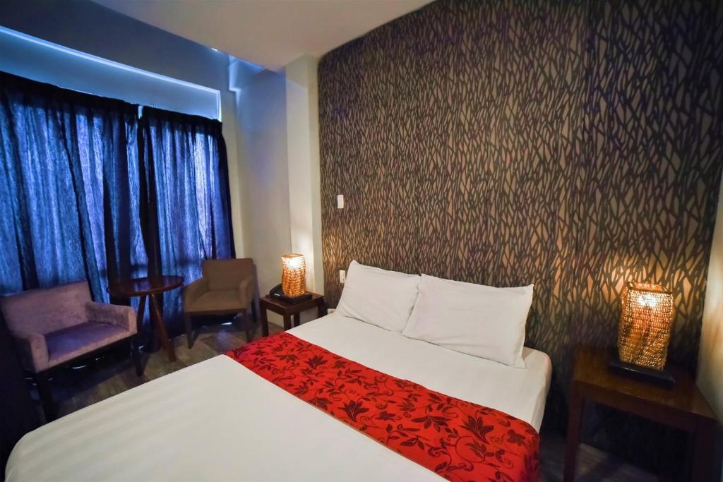 Postel nebo postele na pokoji v ubytování PAN HOTEL AND RESORT