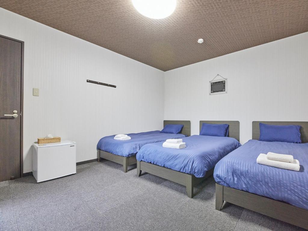 Postel nebo postele na pokoji v ubytování Guesthouse Ama Terrace