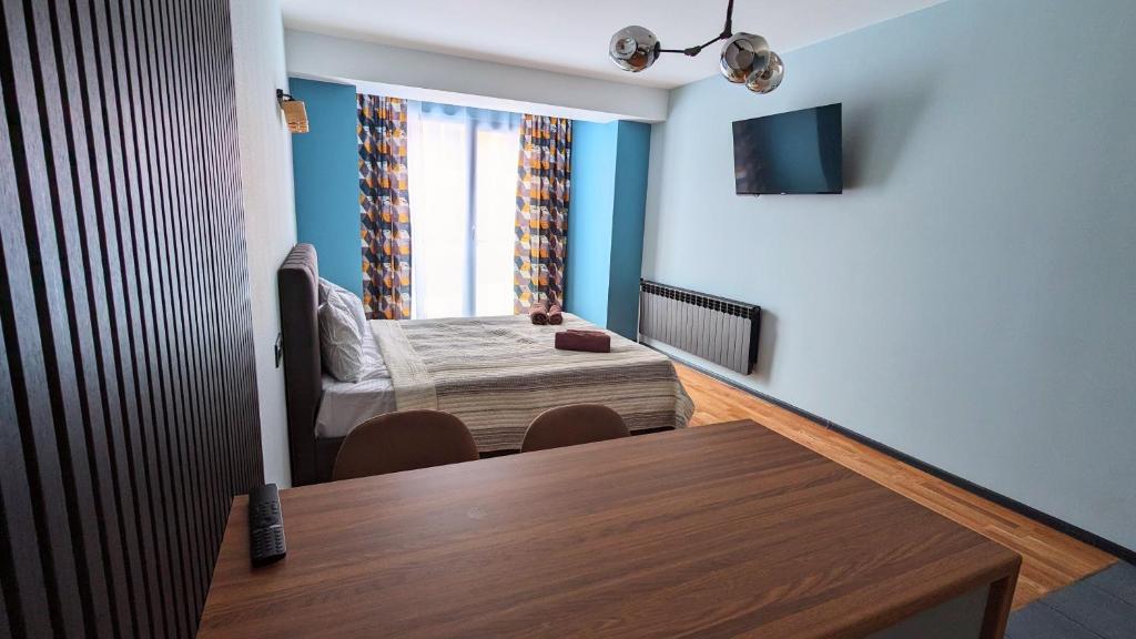 TV a/nebo společenská místnost v ubytování New Gudauri Alpine Charm apartments