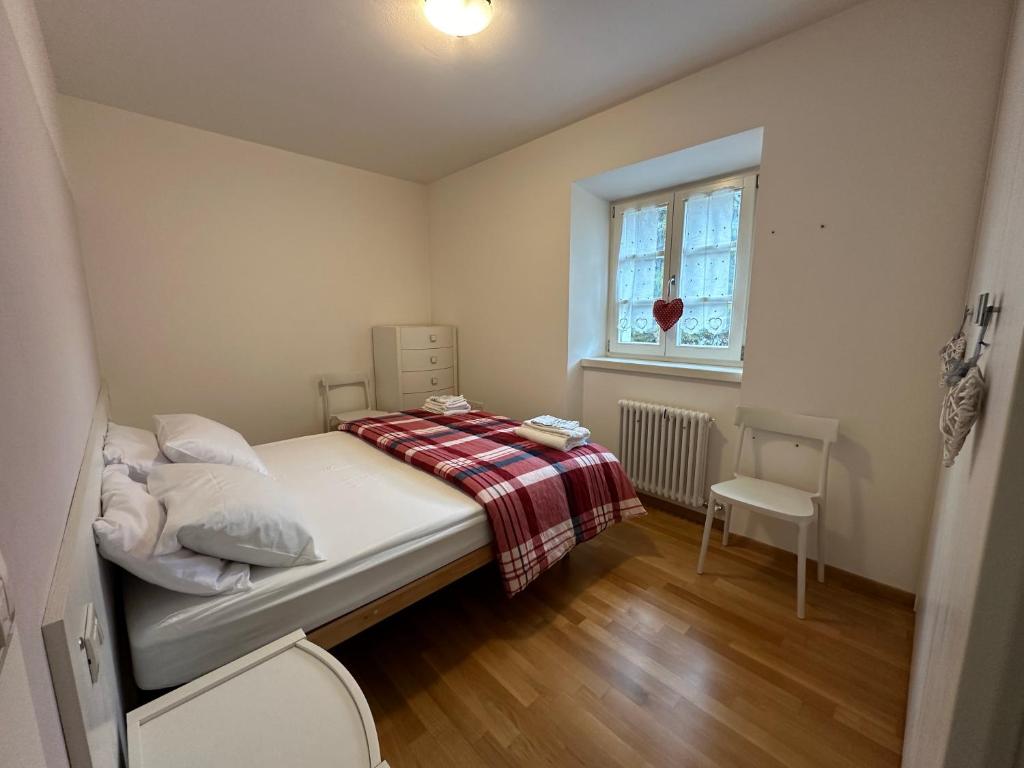 Postel nebo postele na pokoji v ubytování Val di Non Apartment