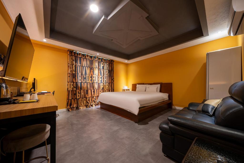 Postel nebo postele na pokoji v ubytování Hotel New Evergreen