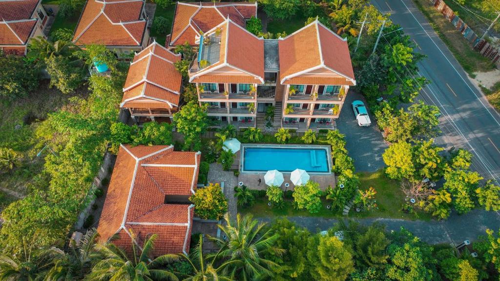 an aerial view of a house with a swimming pool at Angkearboss Villa in Kampot