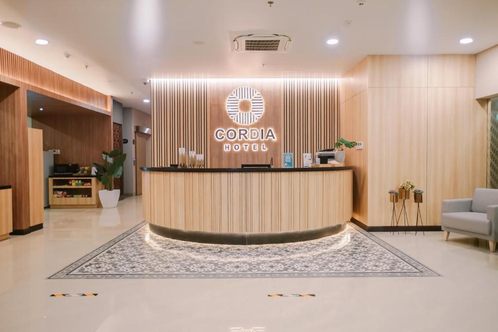 a lobby of a hotel with a reception desk at Cordia Hotel Yogyakarta - Hotel Dalam Bandara in Glagah