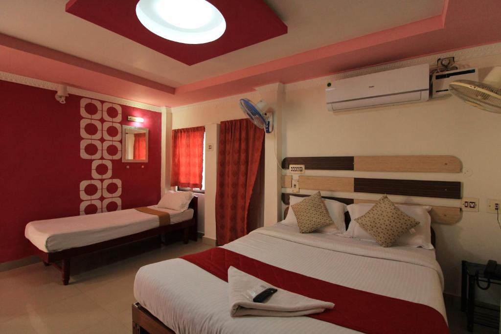 Postel nebo postele na pokoji v ubytování Just Guest House, Chennai Airport