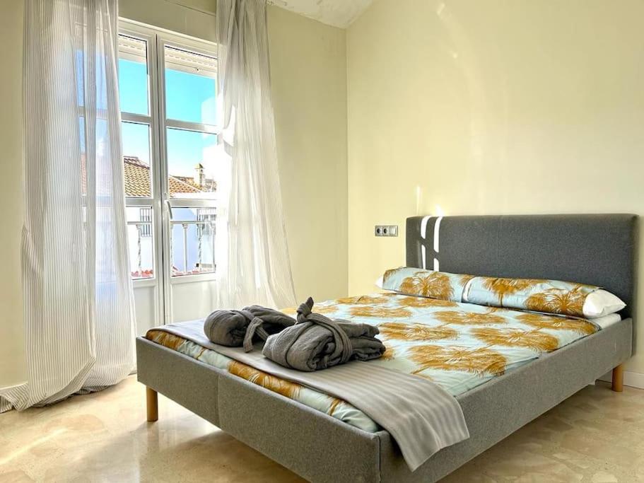 Кровать или кровати в номере Hispalis Aznalcázar