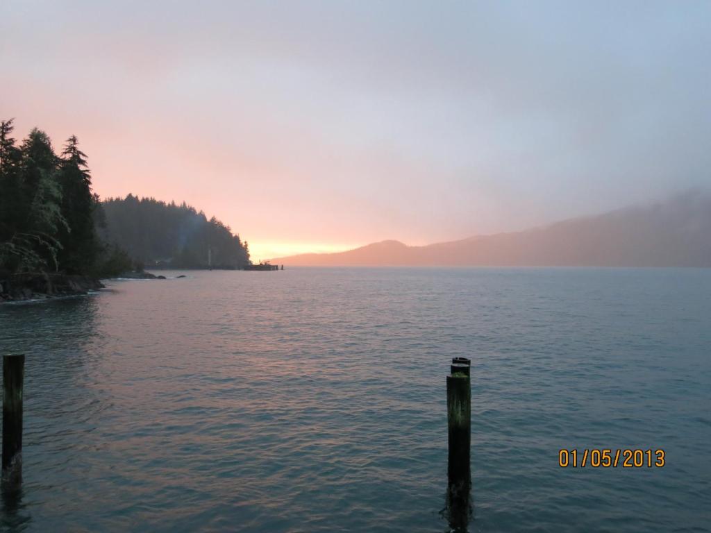 a view of a body of water at sunset at A Shack In The Woods in Port Renfrew