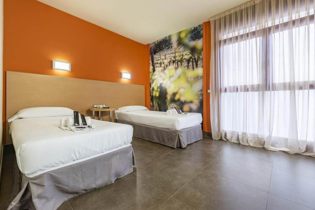 Postel nebo postele na pokoji v ubytování Hotel Pere III El Gran