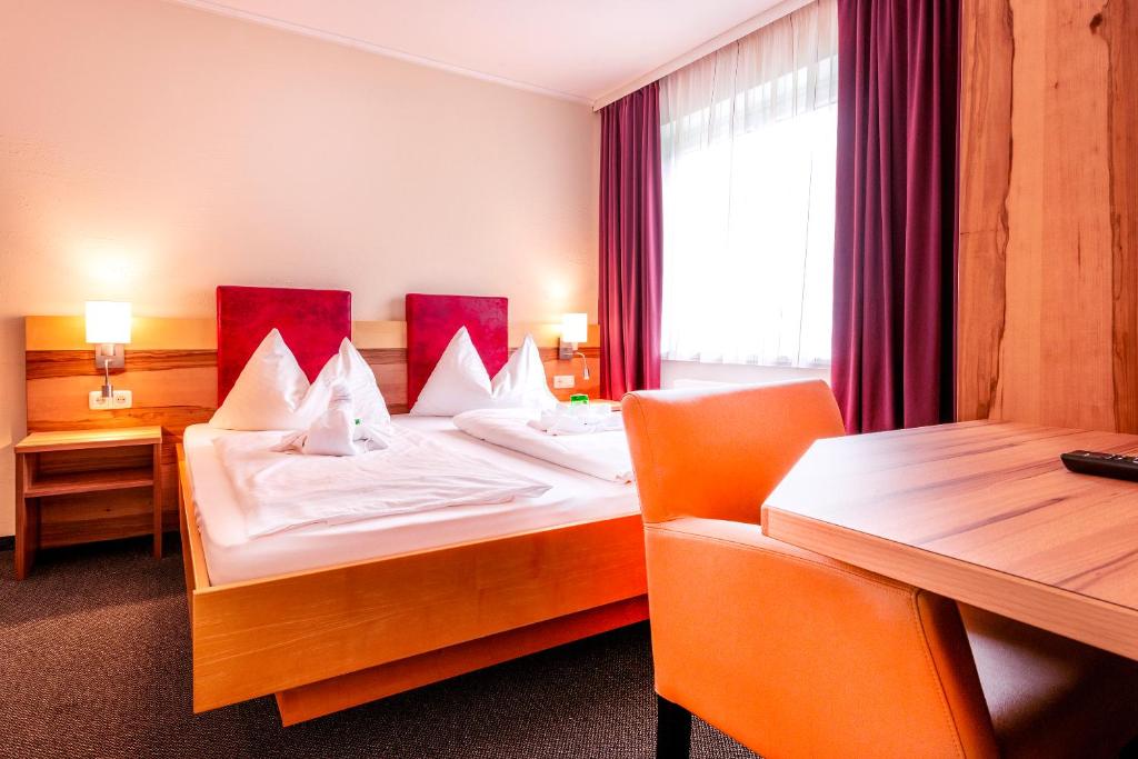 Posteľ alebo postele v izbe v ubytovaní Panorama Hotel Traunstein