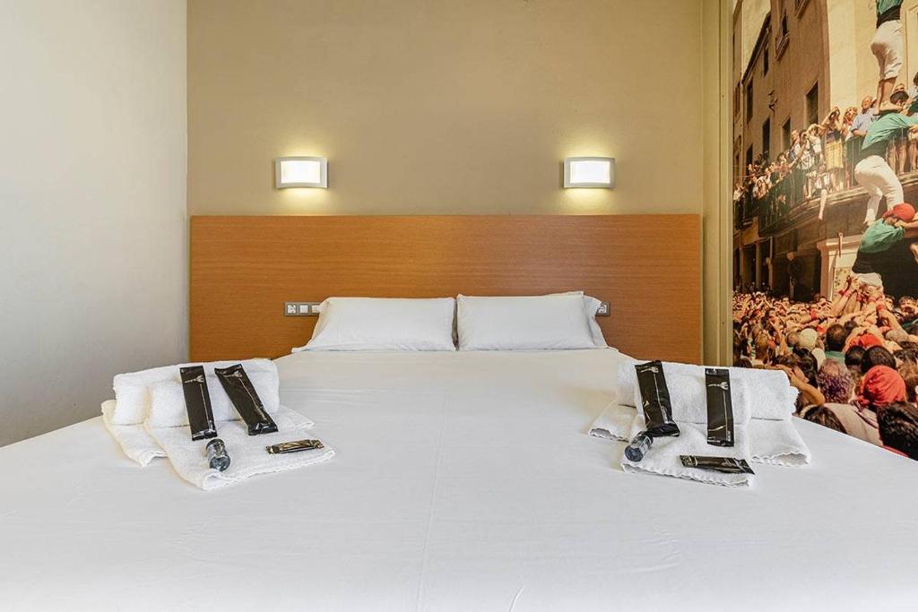 Postel nebo postele na pokoji v ubytování Hotel Pere III El Gran
