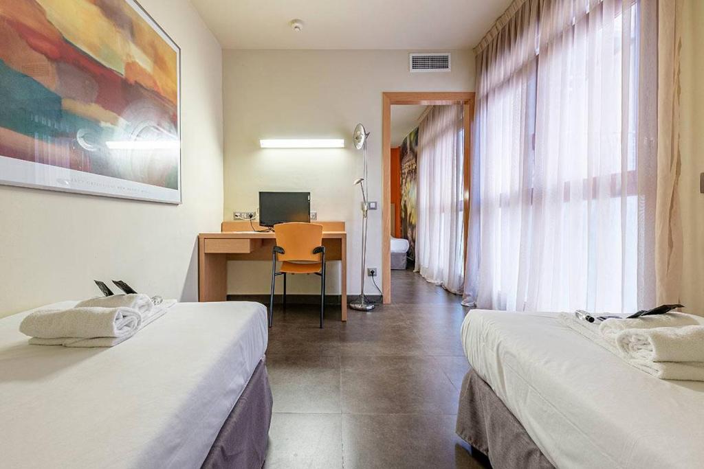 Postel nebo postele na pokoji v ubytování Hotel Pere III El Gran