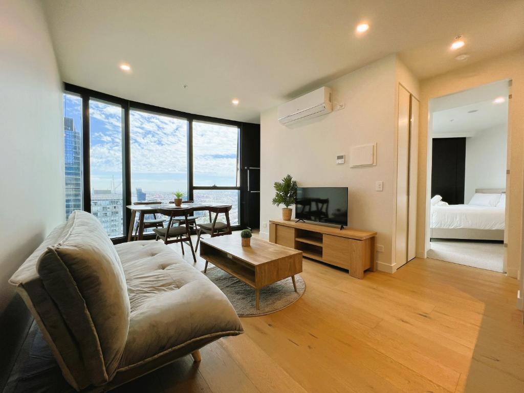 a living room with a couch and a table at 1 BRM 1 BATH, Southern Cross Station, Flagstaff in Melbourne