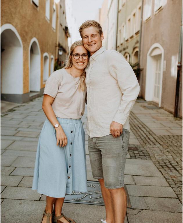 a man and a woman standing on a street at Apartment Wiesenbauer - Chiemgau Karte in Inzell