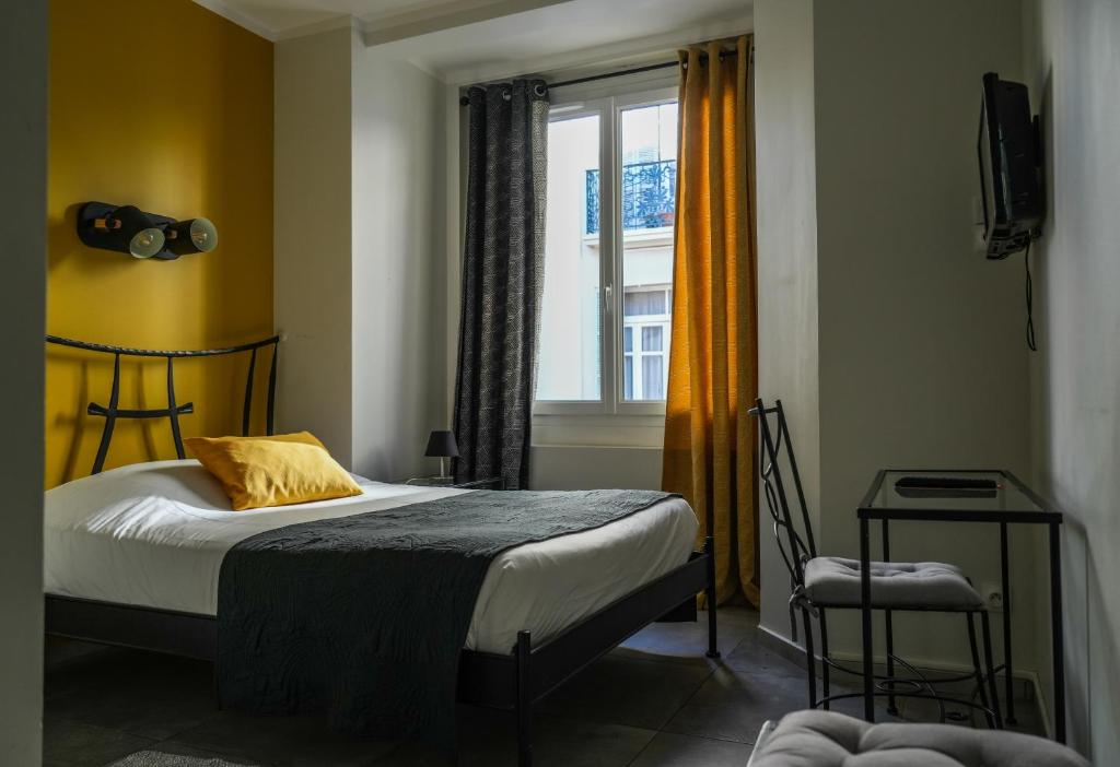 Postel nebo postele na pokoji v ubytování Celenya Hôtel