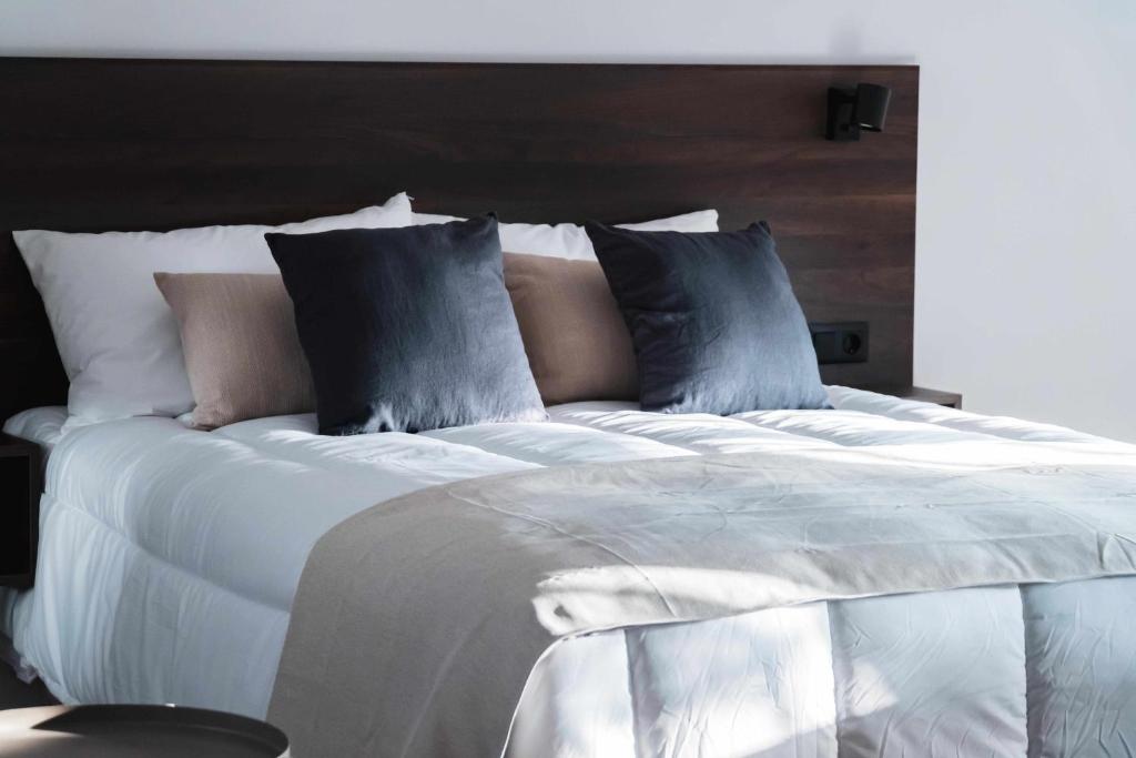 Postel nebo postele na pokoji v ubytování Nido Baeza Suites