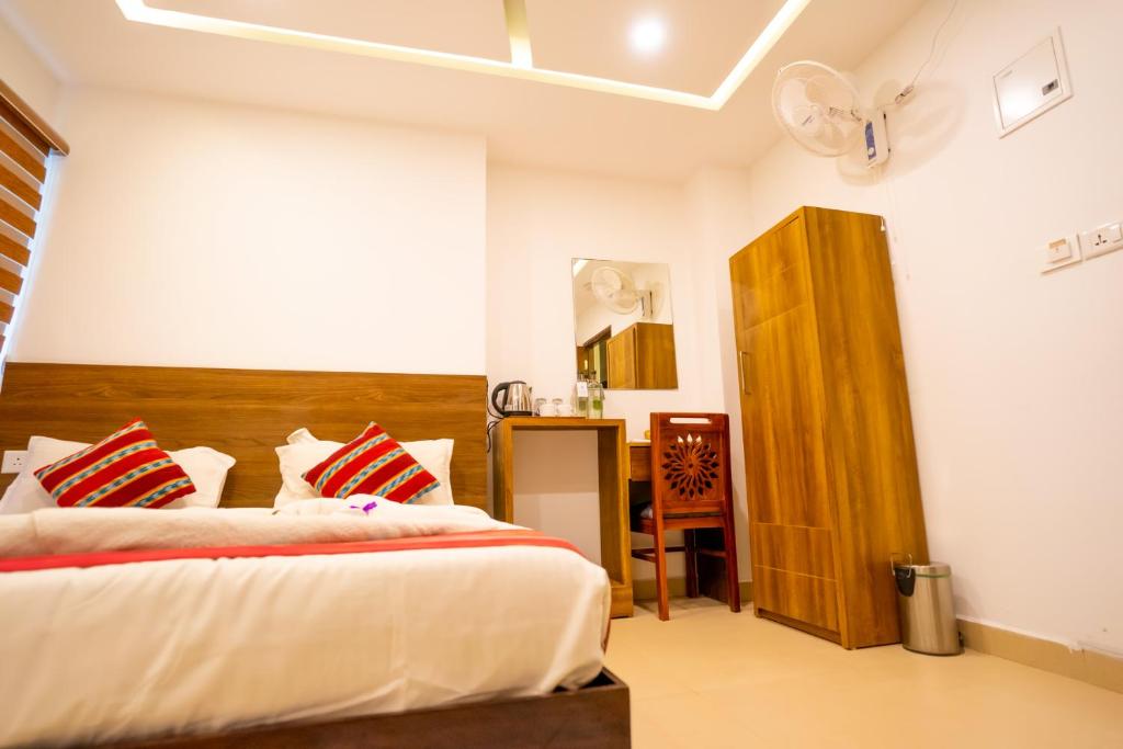 Postel nebo postele na pokoji v ubytování Trivers Resort Munnar