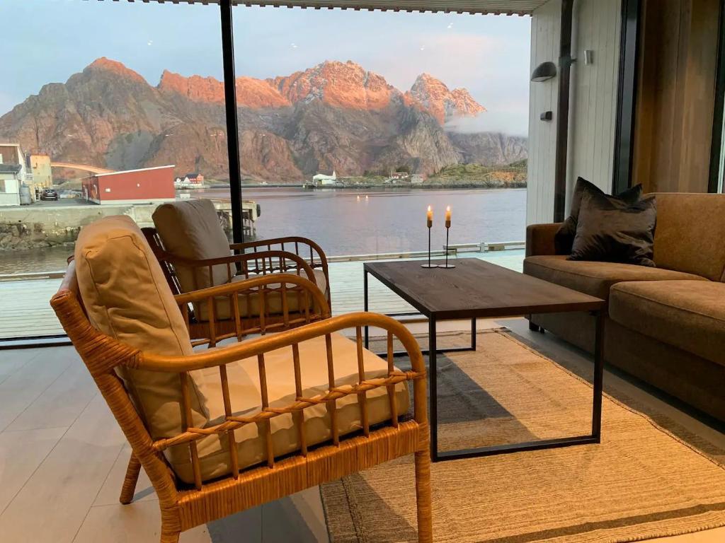 a living room with a couch and a coffee table at Stor moderne leilighet i Henningsvær, 70 kvm in Henningsvær