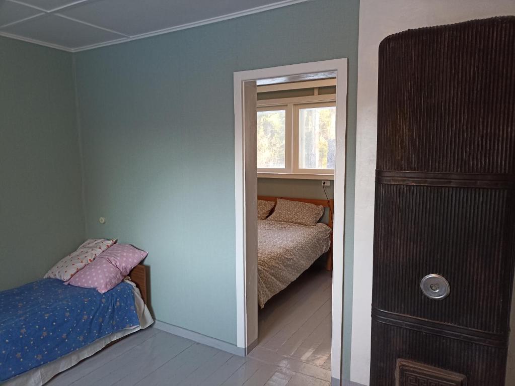 Postel nebo postele na pokoji v ubytování Kuus Tuba